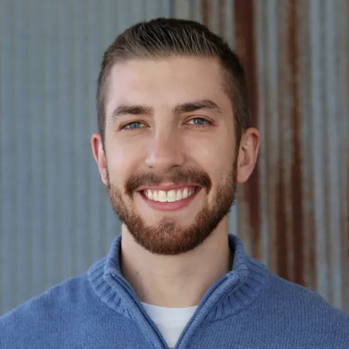 Joe Klipfel, smiling, in a blue sweater.