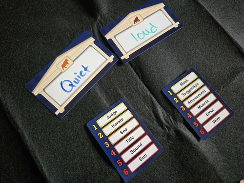Pork cards on a dark cloth: two Bill cards reading Quiet and Loud, and two senators' word lists.